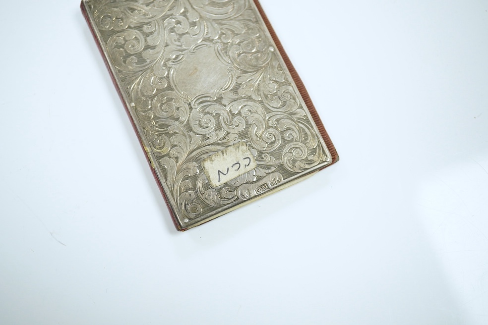 A Victorian silver card case engraved with a heron, maker Nathaniel Mills, Birmingham 1843, in original leather case, another Nathaniel Mills case with foliate scroll engraving, Birmingham 1840, and a silver mounted leat